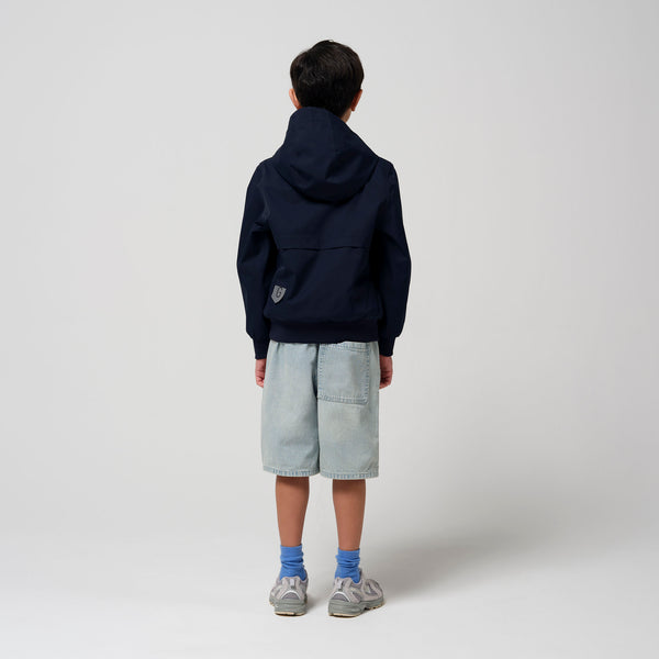 Gosoaky Blue Bird regenjas in donkerblauw voor jongens en meisjes - Verkrijgbaar bij Little Fashion Addict