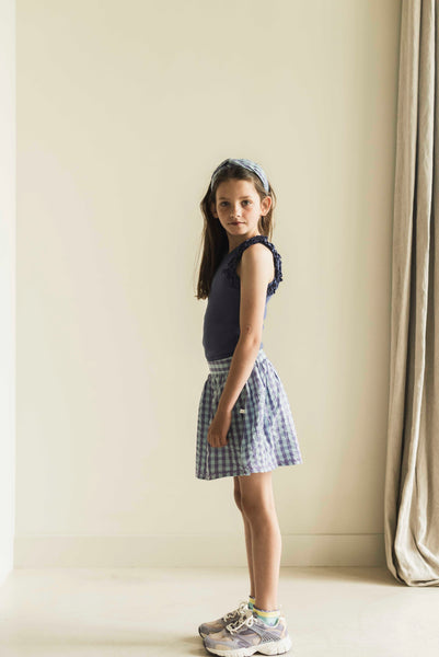 Sara Skirt van Jenest in blauw-lila geruite print, gemaakt van biologisch katoen | Verkrijgbaar bij Little Fashion Addict | Fashion voor meisjes van 4 tot 10 jaar