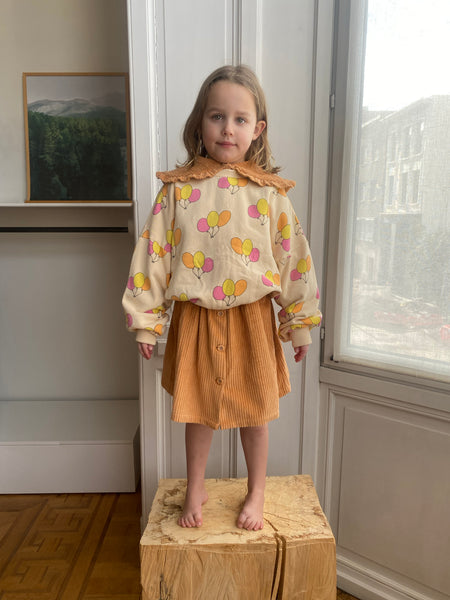 We Are Kids corduroy rok Charlie in oranjetint met knopenrij – duurzame meisjesrok in biologisch katoen | Ontdek We Are Kids bij Little Fashion Addict