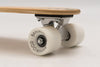 Banwood Skateboard - Natuurkleurig skateboard met donkergroene strepen voor kinderen vanaf 3 jaar - Verkrijgbaar bij Littlefashionaddict.com