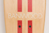 Banwood Skateboard - Natuurkleurig skateboard met donkerrode strepen voor kinderen vanaf 3 jaar - Verkrijgbaar bij Littlefashionaddict.com
