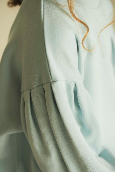 Meisjes sweater van Jenest in pastelblauw met ballonmouwen en sterdetail | verkrijgbaar bij Little Fashion Addict