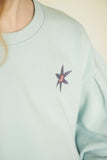 Meisjes sweater van Jenest in pastelblauw met ballonmouwen en sterdetail | verkrijgbaar bij Little Fashion Addict