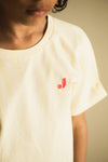 Unisex T-shirt van Jenest in zonnig geel met streepjes | Nurture T-shirt Sunny Yellow Stripe | Verkrijgbaar voor jongens en meisjes van 4 tot 10 jaar bij Little Fashion Addict