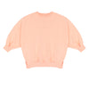 Pippa Sweater Peach Orange van Jenest – abrikooskleurige oversized meisjes sweater met bloemenprint op de rug | Ontdek Jenest bij Little Fashion Addict
