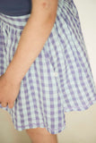 Sara Skirt van Jenest in blauw-lila geruite print, gemaakt van biologisch katoen | Verkrijgbaar bij Little Fashion Addict | Fashion voor meisjes van 4 tot 10 jaar