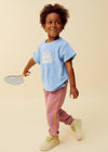 Jongen draagt blauwe terry t-shirt Soleil van Sproet & Sprout uit de Champions League of Fun collectie | Verkrijgbaar bij Little Fashion Addict