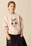 Ecru sweater voor meisjes van Wander & Wonder met kersenprint en W&W logo