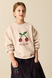 Ecru sweater voor meisjes van Wander & Wonder met kersenprint en W&W logo
