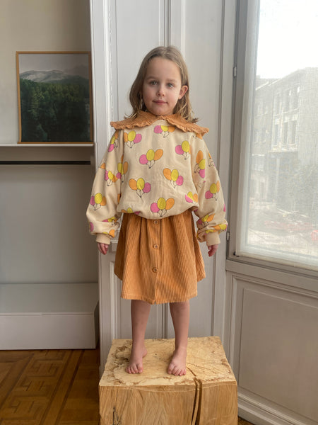 We Are Kids corduroy rok Charlie in oranjetint met knopenrij – duurzame meisjesrok in biologisch katoen | Ontdek We Are Kids bij Little Fashion Addict