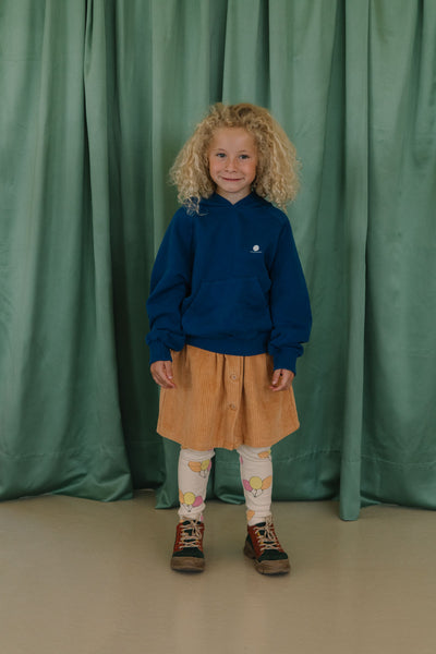 We Are Kids corduroy rok Charlie in oranjetint met knopenrij – duurzame meisjesrok in biologisch katoen | Ontdek We Are Kids bij Little Fashion Addict
